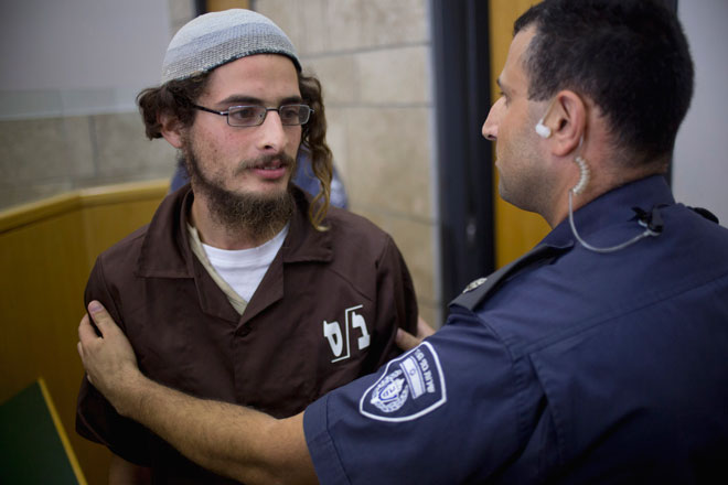 Head of a Jewish extremist group Meir Ettinger appears in court in Nazareth Illit , Israel, on Tuesday (AP photo)