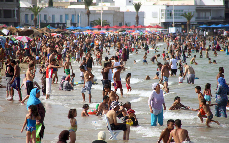 People gather at a public beach on a hot day at La Goulette seaside in Tunis, Tunisia, on Sunday (Reuters photo)