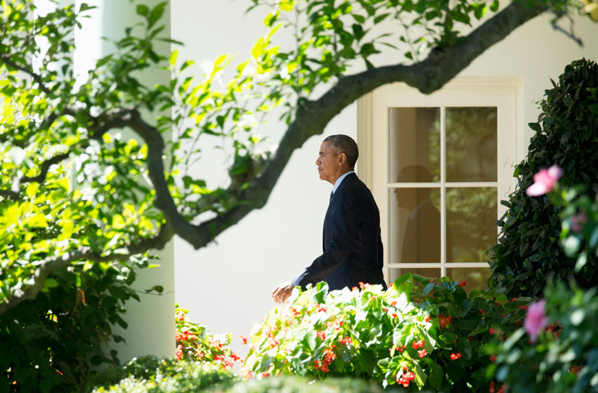 President Barack Obama walks along the Colonnade outside the Oval Office of the White House in Washington, on Friday (AP photo)