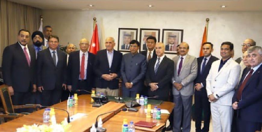 Officials pose for a group photo during a signing ceremony of several agreements between the the Jordan Phosphate Mines Company and Indian companies (Petra photo)