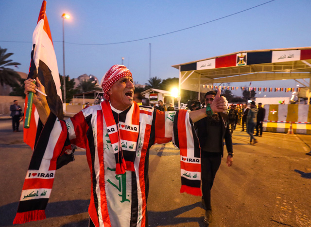 Iraqis celebrate the reopening of the Green Zone, home to government buildings and Western embassies, on Monday in the capital Baghdad (AFP photo)