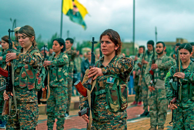 Fighters from the Kurdish women's protection units attend the funeral of a fellow fighter, who was killed while fighting Daesh, in the Syrian city of Qamishli, on Saturday (AFP photo)