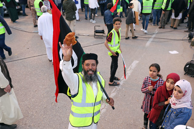  A Libyan protester holds a croissant (La Brioche) as he attends a demonstration to demand an end to the Khalifa Haftar's offensive against Tripoli, in Martyrs Square in central Tripoli, Libya, April 19 (Reuters photo)