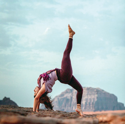 Raneen Nawaiseh, a yoga instructor, strikes a yoga pose in Wadi Rum (Photo courtesy of Saif Khlaifat)