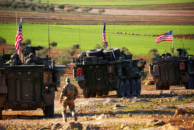 In this file photo taken on March 05, 2017, a convoy of US forces armoured vehicles drives near the village of Yalanli, on the western outskirts of the northern Syrian city of Manbij (AFP photo)