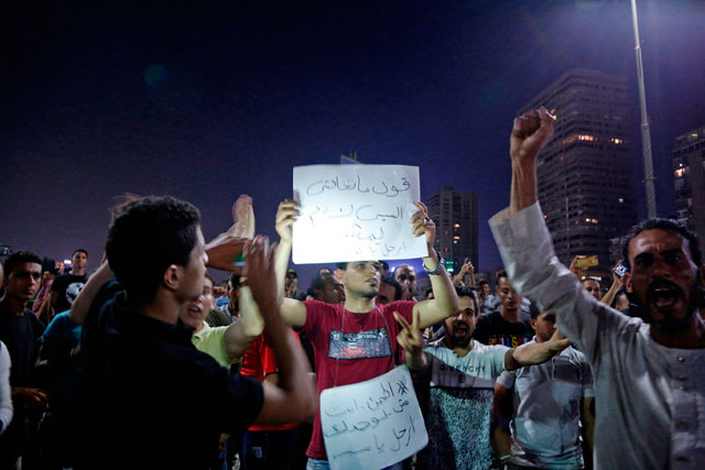 Egyptian protesters shout slogans as they take part in a protest calling for the removal of President Abdel Fattah El Sisi in Cairo's downtown on Friday (AFP photo)