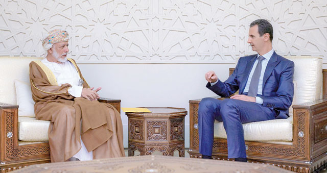 This handout photo released by the official Syrian Arab News Agency on Sunday shows Omani Foreign Minister Yusuf Bin Alawi Bin Abdullah (left) meeting with Syrian President Bashar Assad in the capital Damascus (AFP photo)
