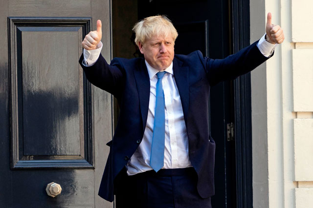   New Conservative Party leader and incoming prime minister Boris Johnson arrives at the Conservative Party headquarters in central London on Tuesday (AFP photo)