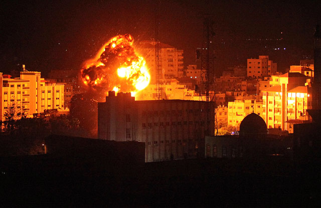 Flame and smoke are seen during an Israeli air strike in Gaza City on Monday (Reuters photo)