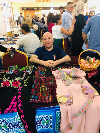   A man showcasing his handicrafts at the ‘people of determination’ charity bazaar (Photo courtesy of the HCD)