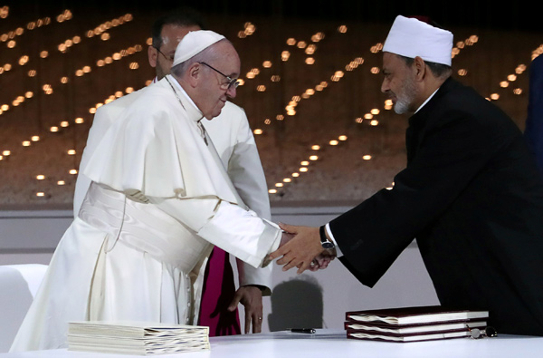 Pope Francis shakes hands with Grand Imam of Al Azhar Sheikh Ahmed Al Tayeb after signing a document on fighting extremism, during an inter-religious meeting at the Founder's Memorial in Abu Dhabi, United Arab Emirates, on Monday  (Reuters photo)