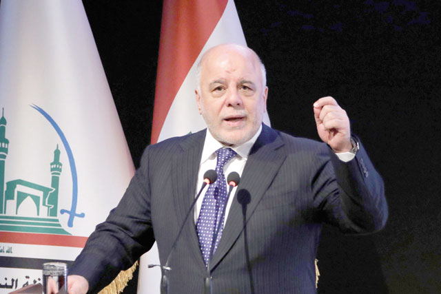 This file photo taken on January 7 shows Iraqi Prime Minister Haider Al Abadi delivering a speech during a ceremony in the Shiite holy city of Najaf (AFP photo)