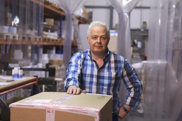 David Cox, managing director of Fragrances of Ireland, poses for a photograph at his perfume warehouse in Wicklow, Ireland, on May 3  (Reuters photo)
