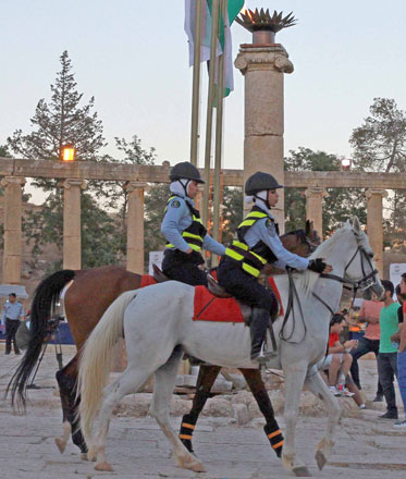 Police women patrol the venue of the 31st Jerash Festival for Culture and Arts in the ancient city last week (Photo by Hassan Tamimi)