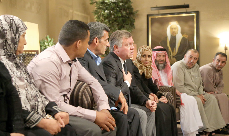 His Majesty King Abdullah on Sunday meets with the families of soldiers and security personnel who fell in the June 21 terror attack on the northern border (Photo courtesy of Royal Court)