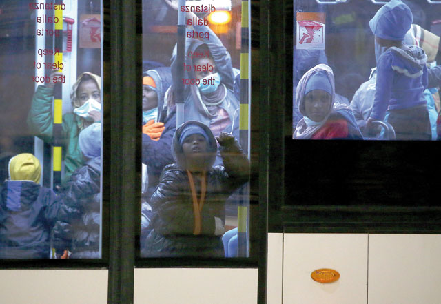 Evacuated migrants taken out of detention centres by the UNHCR from Tripoli in Libya arrive at the military airport Pratica di Mare in Rome, Italy, on Friday (Reuters photo)