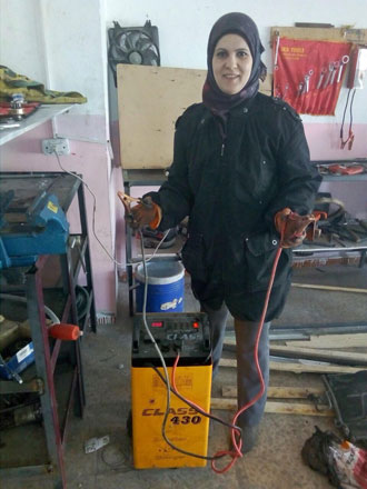 Balqees Bani Hani poses for a photo at her garage in Irbid, some 80km north of Amman (Photo courtesy of Balqees Bani Hani )