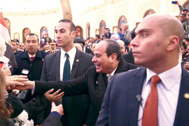 Egyptian President Abdel Fattah El Sisi greets worshippers during the inauguration of the massive Cathedral of the Nativity of Christ in Egypt's New Administrative Capital, 45 kilometres  East of Cairo, on Saturday (AFP handout photo)