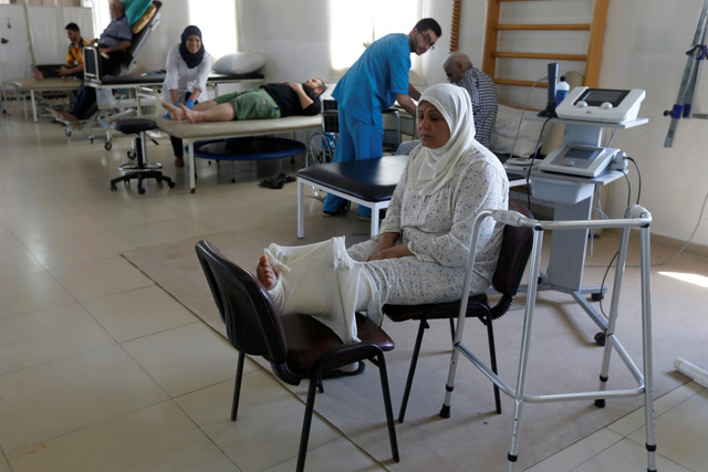 A woman, who was wounded in Syria, rests inside a hospital in Tripoli, Lebanon, May 23 (Reuters photo)
