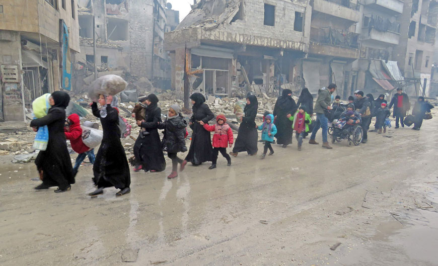 Syrian residents, fleeing violence in the restive Bustan Al Qasr neighbourhood, arrive in Aleppo’s Fardos neighbourhood on Tuesday, after regime troops retook the area from rebel fighters (AFP photo)