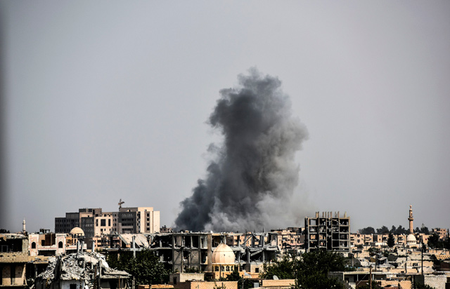 In this file photo taken on July 17, 2017, smoke billows following an air strike on the western frontline of Raqqa, during an offensive by the US-backed Syrian Democratic Forces, a majority Kurdish and Arab alliance, to retake the city from Daesh terrorist group (AFP photo)