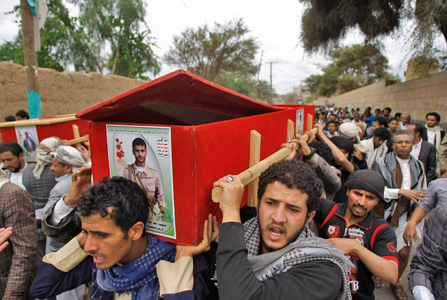 Shiite rebels known as Houthis carry coffins of men who were killed in a Saudi-led air strike during their funeral in Sanaa,  Yemen, on Monday (AP photo)