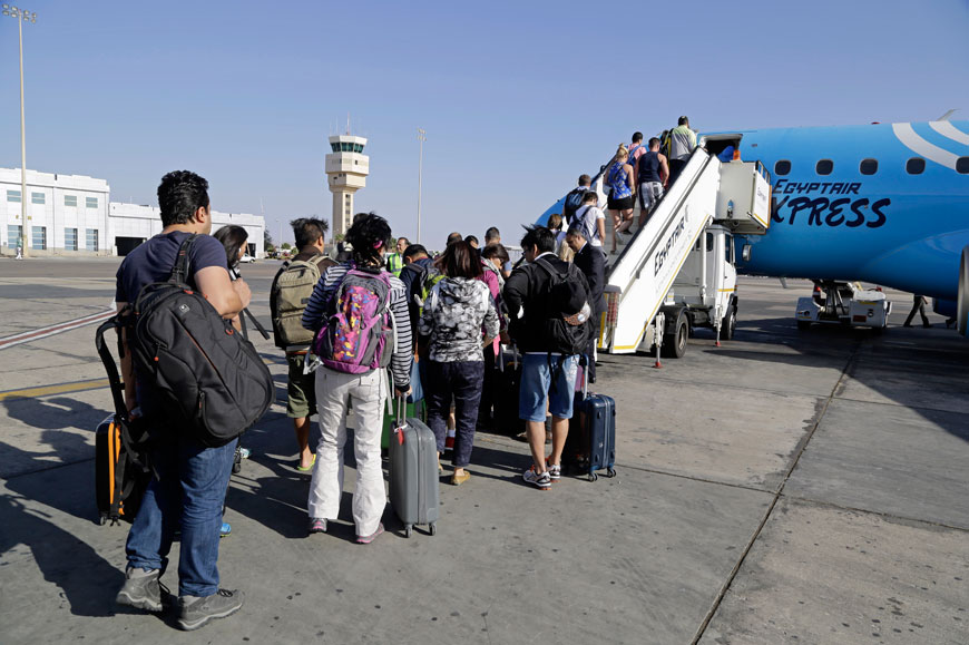 Passengers board an Egyptair Express plane bound for Cairo at Sharm El Sheikh Airport, south Sinai, on Monday (AP photo)