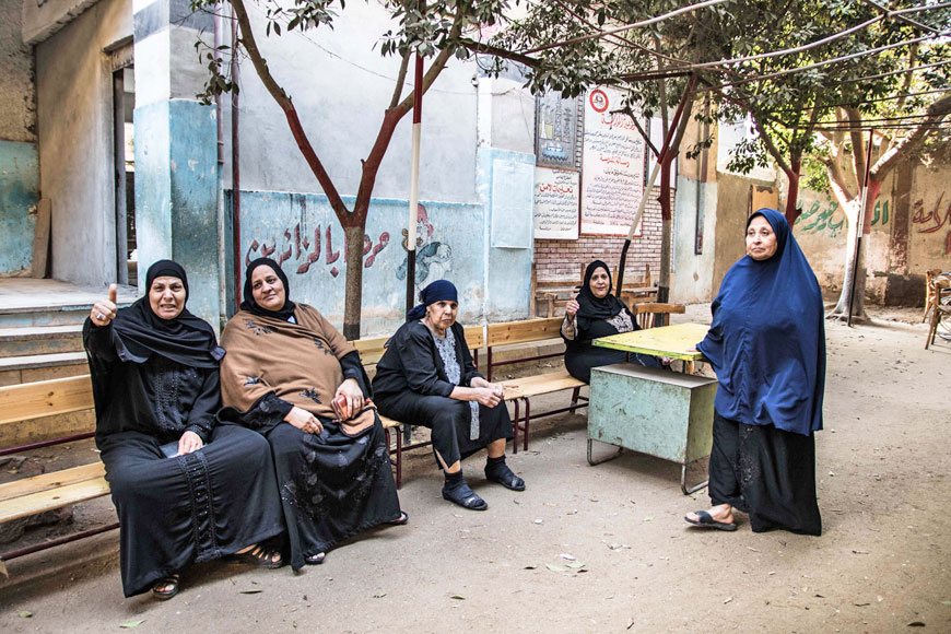 Women wait to vote at a polling station during parliamentary elections in Cairo, on Sunday (AP photo)
