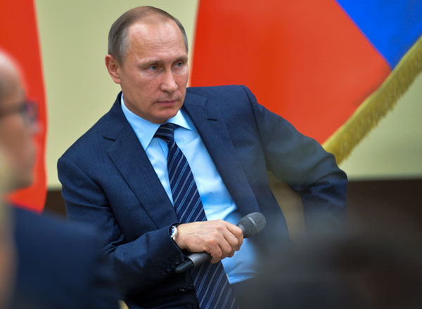 Russian President Vladimir Putin gestures while listening to a question during a meeting with representatives of ‘Popular Front’ broad movement at the Novo-Ogaryovo residence outside Moscow, on Friday (AP photo)