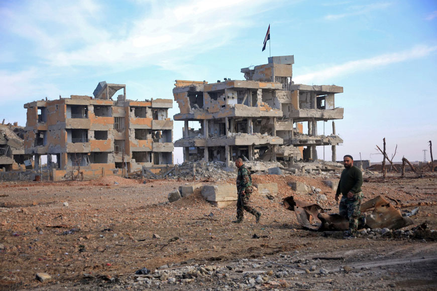 Syrian army soldiers patrol the countryside of Deir Hafer, a former bastion of the Daesh terror group, near the northern Syrian city of Aleppo on Wednesday (AFP photo)