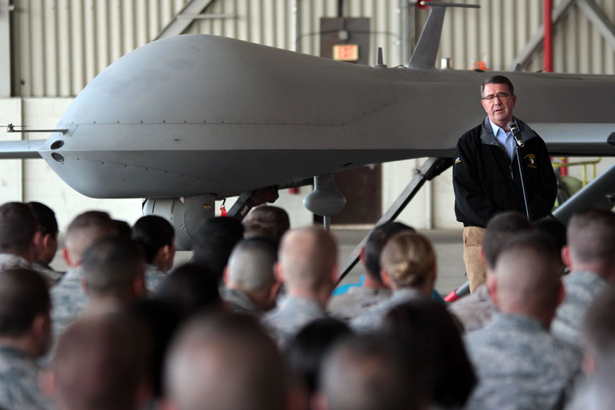 US Defence Secretary Ash Carter addresses the US troops as he stands in front of a drone at the Incirlik Air Base near Adana, Turkey, Tuesday (AP photo)