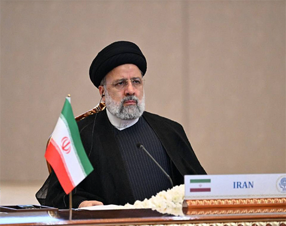 This handout photograph taken and released by Uzbekistan's Presidential Press Service on Thursday shows Iran's President Ebrahim Raisi attending the 16th Economic Cooperation Organisation Summit in Tashkent (AFP photo)