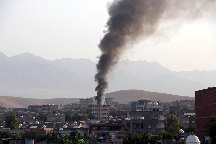 Smoke billows from a fire during firefight between police and Kurdistan Workers Party, or PKK militants in the town of Silopi, southeastern Turkey, Friday (AP photo)