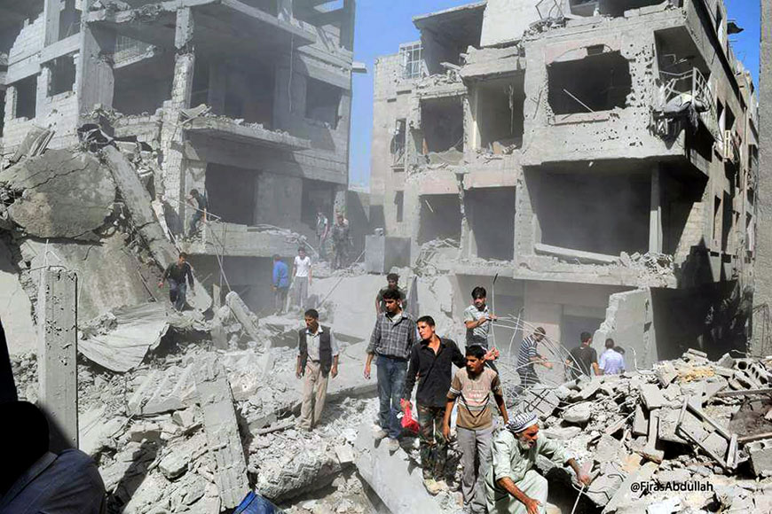 This picture released by the Douma Revolution News Network on their Facebook page shows Syrians inspecting damage following a Syrian government air strike on the Damascus suburb of Douma, Syria, Saturday (AP photo)