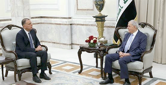 Iraqi President Abdul Latif Rashid receives Interior Minister Mazen Faraya at the Baghdad Palace on Sunday (Petra photo)