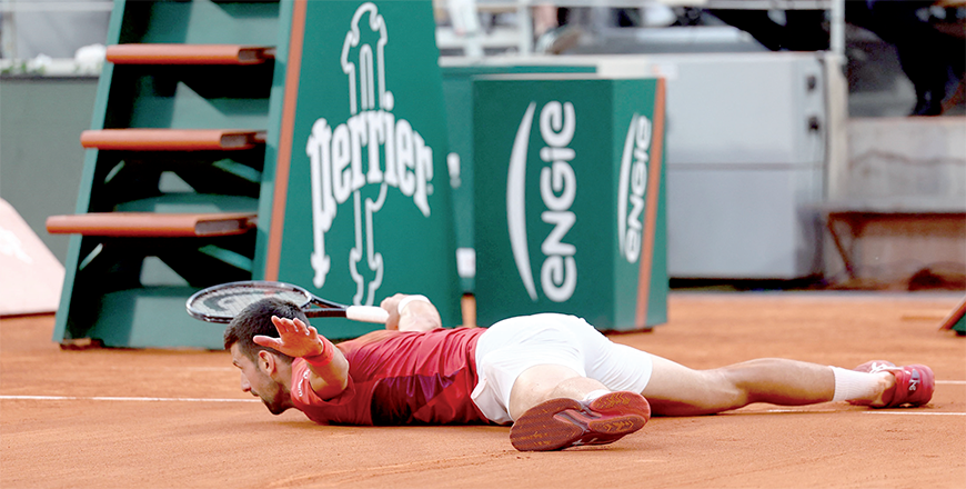 Serbia’s Novak Djokovic lays on the court during his men’s singles round of sixteen match against Argentina’s Francisco Cerundolo on Court Philippe-Chatrier on day nine of the French Open tennis tournament at the Roland Garros Complex in Paris on Monday (AFP photo)