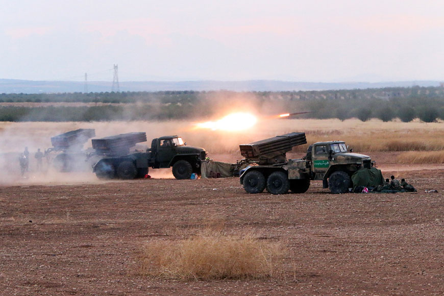 In this photo taken on Wednesday, Syrian army rocket launchers fire near the village of Morek in Syria (AP photo)