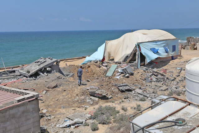 A man inspects the wreckage of houses and tents, that belong to Palestinian resistance group, after the warplanes of Israel carried out an airstrike over residential areas in Deir Al Balah, Gaza, on Wednesday (Anadolu Agency photo)