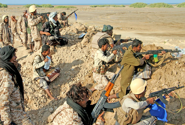 Yemeni pro-government forces take position during clashes against Shiite rebels in Yemen’s western Dhubab district, about 30km north of the strategic Bab Al Mandab Strait, on Monday (AFP photo)