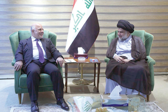 This handout photo released by the Iraqi prime minister's press office on Sunday shows Iraqi Prime Minister Haider Al Abadi meeting with Iraqi Shiite cleric and leader Moqtada Al Sadr in Baghdad (AFP photo)