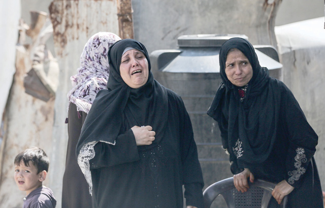 Relatives of 28-year-old Hamas fighter Mahmoud Al Adham mourn during his funeral in Jabaliya in the northern Gaza Strip on Thursday. Adham was killed by Israeli fire near the border fence in the Gaza Strip on Thursday, according to Hamas (AFP photo)