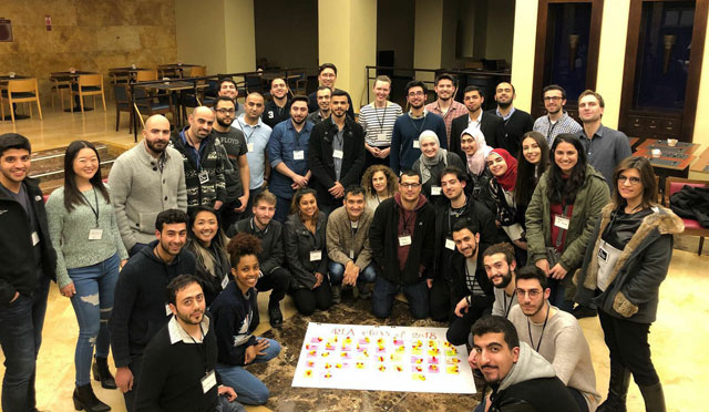 The 13 teams of Arab innovators pose for a group photo after the final pitching session in Amman on Friday (Photo by Camille Dupire)