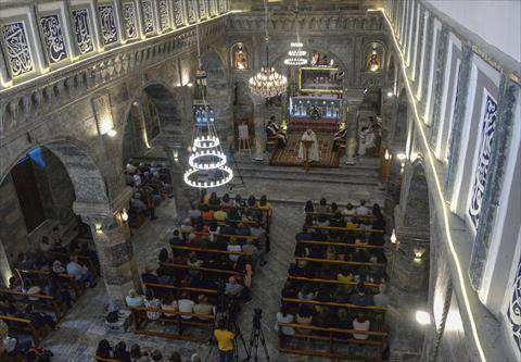 Christian worshippers attend mass at the Syriac Catholic Church of Saint Thomas in Iraq's northern city of Mosul on Saturday for the first time after its restoration as it was heavily damaged during battles to liberate the city from the Daesh terror group (AFP photo)