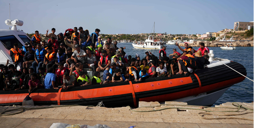 In this file photo migrants arrive in the harbour of Italian island of Lampedusa on September 18 (AFP photo)