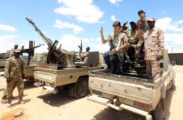 This file photo taken on July 20 shows fighters loyal to the UN-recognised Libyan Government of National Accord (GNA) secure the area of Abu Qurain, half-way between the capital Tripoli and Libya's second city Benghazi, against forces loyal to Khalifa Haftar, who is based in eastern Benghazi (AFP photo)