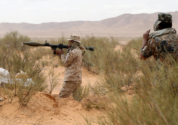A member of Libya's Petroleum Facilites Guard takes part in a defence exercise near the town of Bir Al Ghanam, about 100 kilometres southwest of Libya's capital Tripoli, on Monday (AFP photo)
