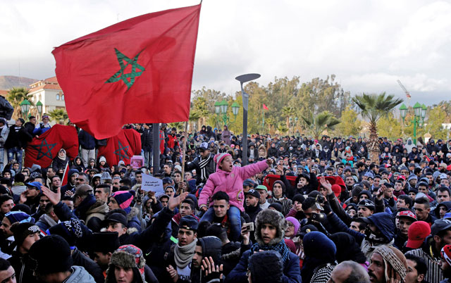 People shout slogans during a protest after two miners died while working in a clandestine coal mine in Jerada, Morocco, on Thursday (AFP photo)