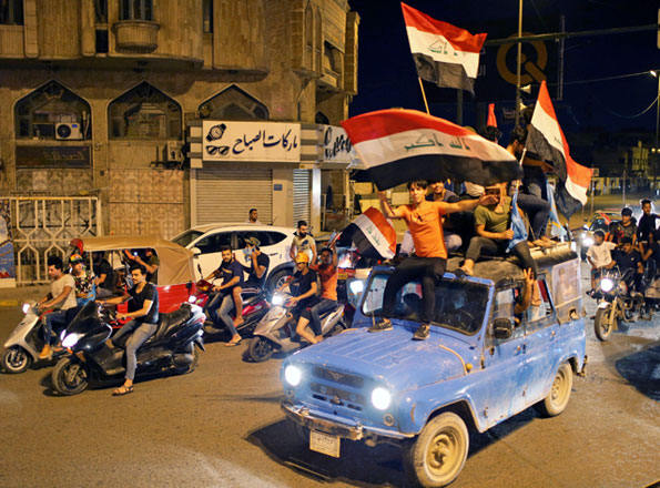 Iraqi supporters of Sairun list celebrate after the results of Iraq's parliamentary election were announced in Baghdad, Iraq, on Monday (Reuters photo)