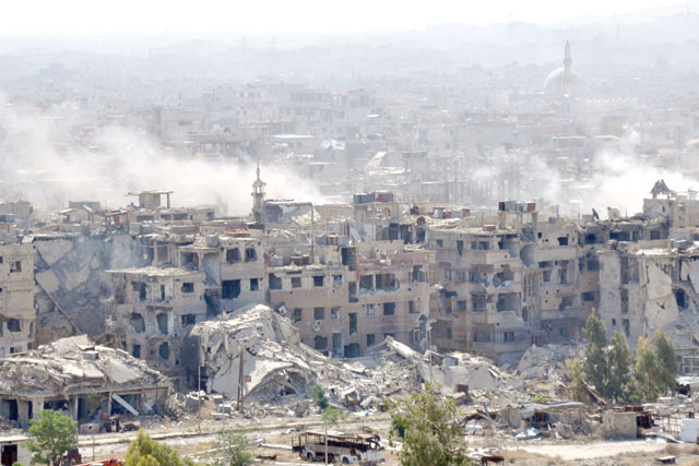 This photo taken on Saturday shows smoke billowing from the Palestinian camp of Yarmouk during regime strikes targeting the Daesh terrorist group in the camp (AFP photo)