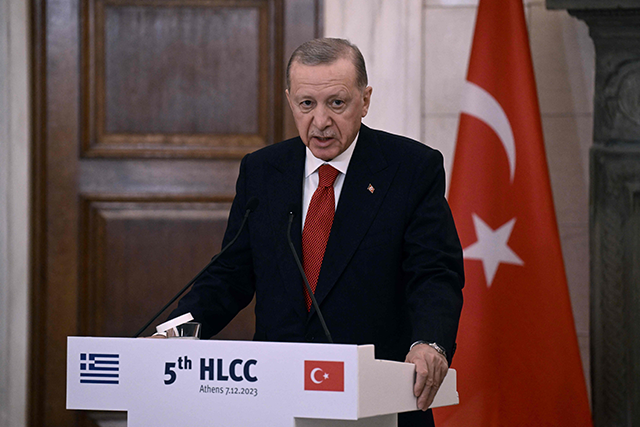 Turkish President Recep Tayyip Erdogan speaks to the press following a meeting with the Greek prime minister Kyriakos Mitsotakis during an official visit to Greece, in Athens, on Thursday (AFP photo)